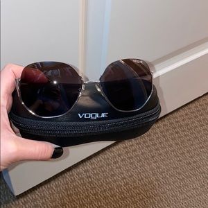 Vogue sunglasses with a hard case.